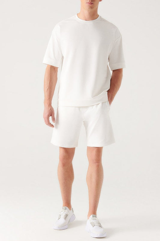 Men wearing white knitted cotton shorts and white top, front full view – Swiftyle
