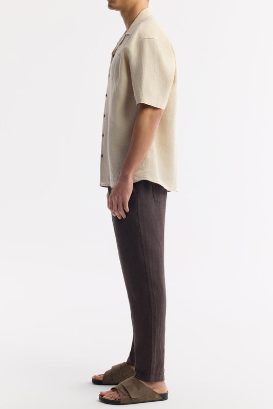 Side profile of model wearing Swiftyle Men's Beige Linen Shirt