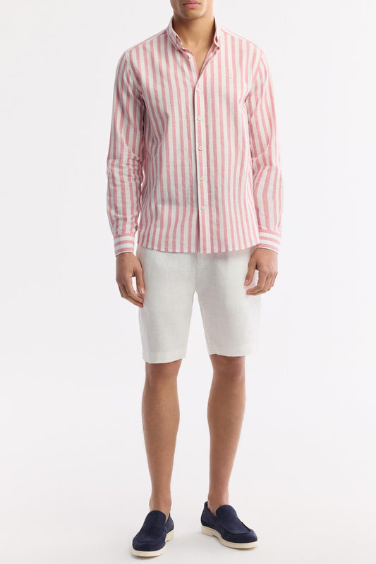 Full-body view of pink striped shirt styled for summer