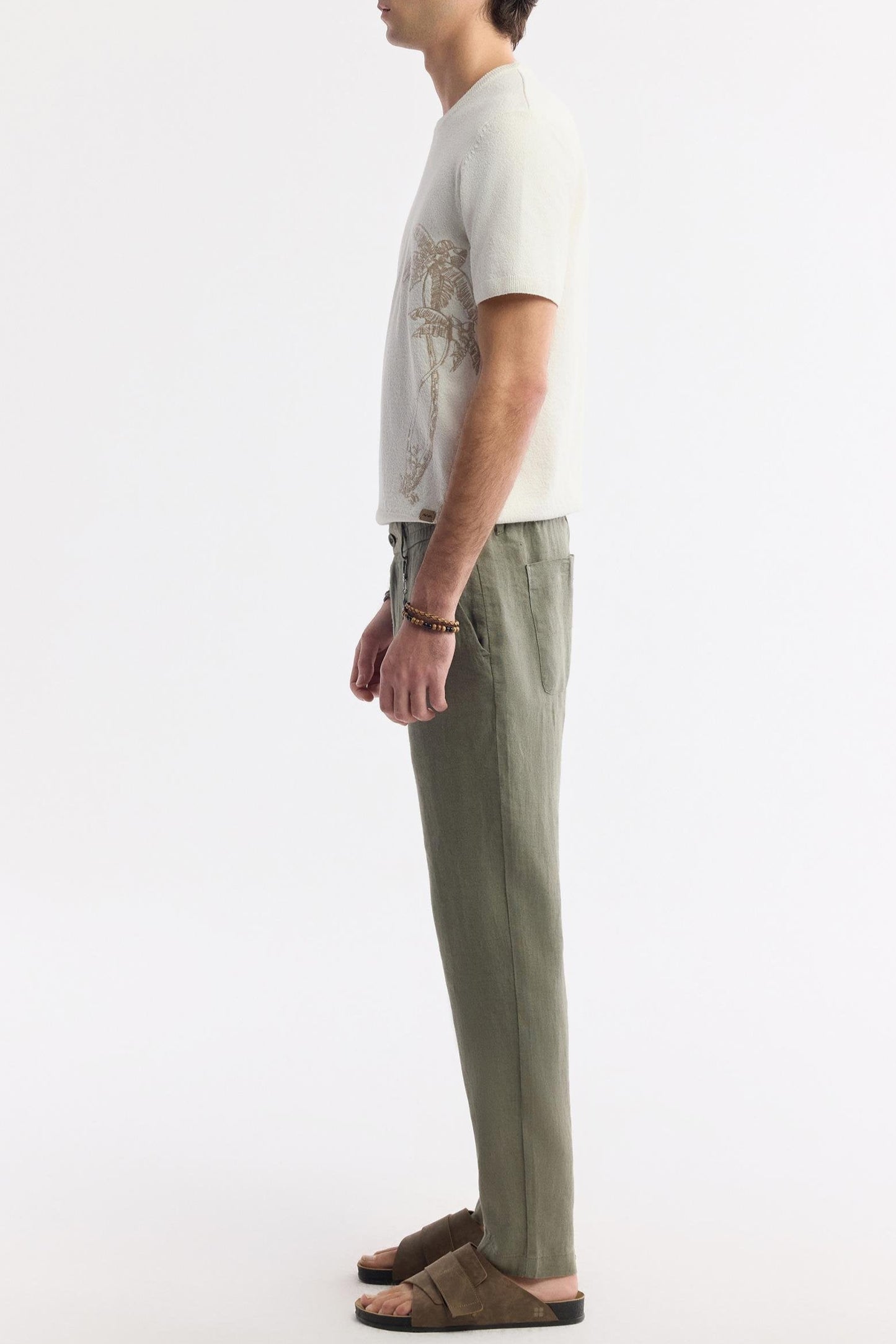 Side view of model in Olive Green Linen Pants