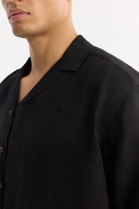 Close-up of collar and fabric texture on black linen shirt