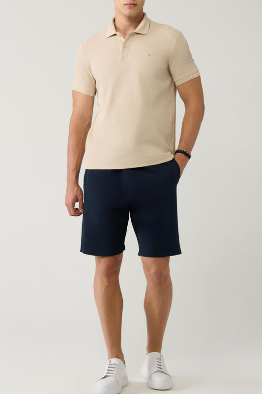 Men wearing navy cotton shorts with beige polo – front full view – Swiftyle