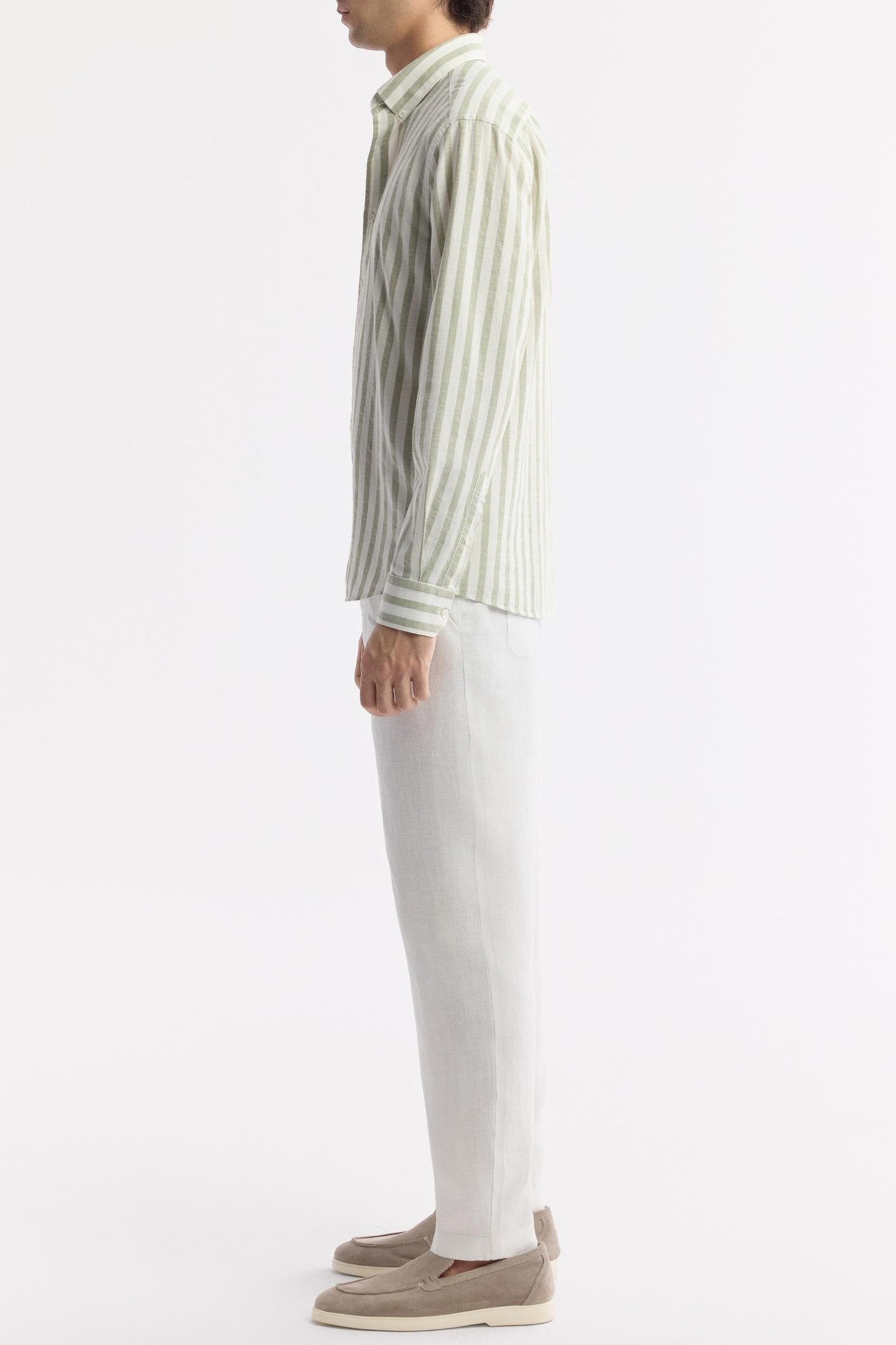 Side view of model in green striped Egyptian cotton shirt