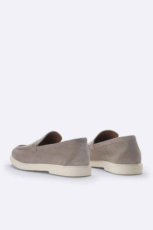 Back heel view of gray suede loafers for men
