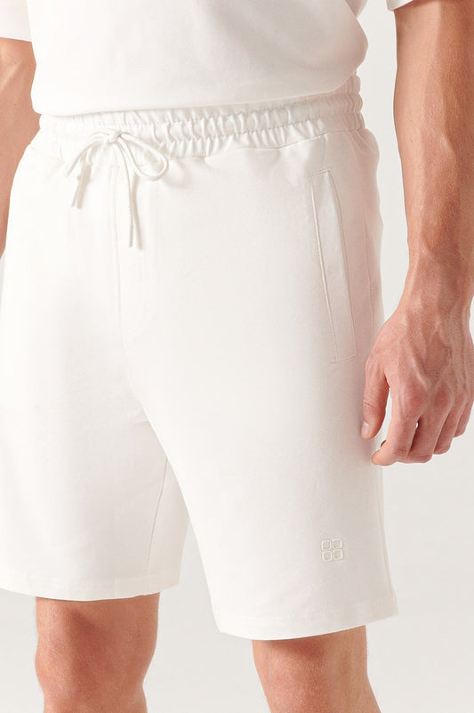 Close-up of waistband and pocket seam on white cotton shorts – Swiftyle