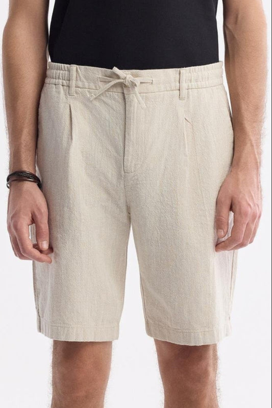 Men’s beige linen shorts with drawstring waist – front view close-up