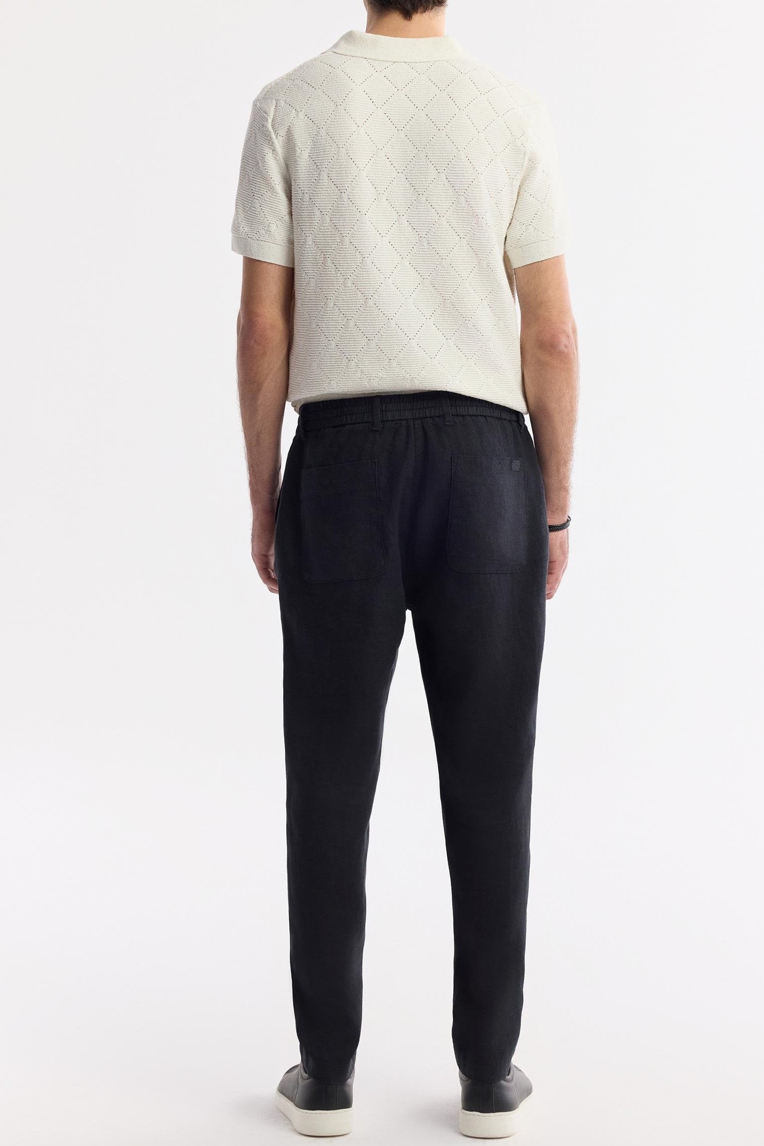 Back view showing patch pockets and waist fit