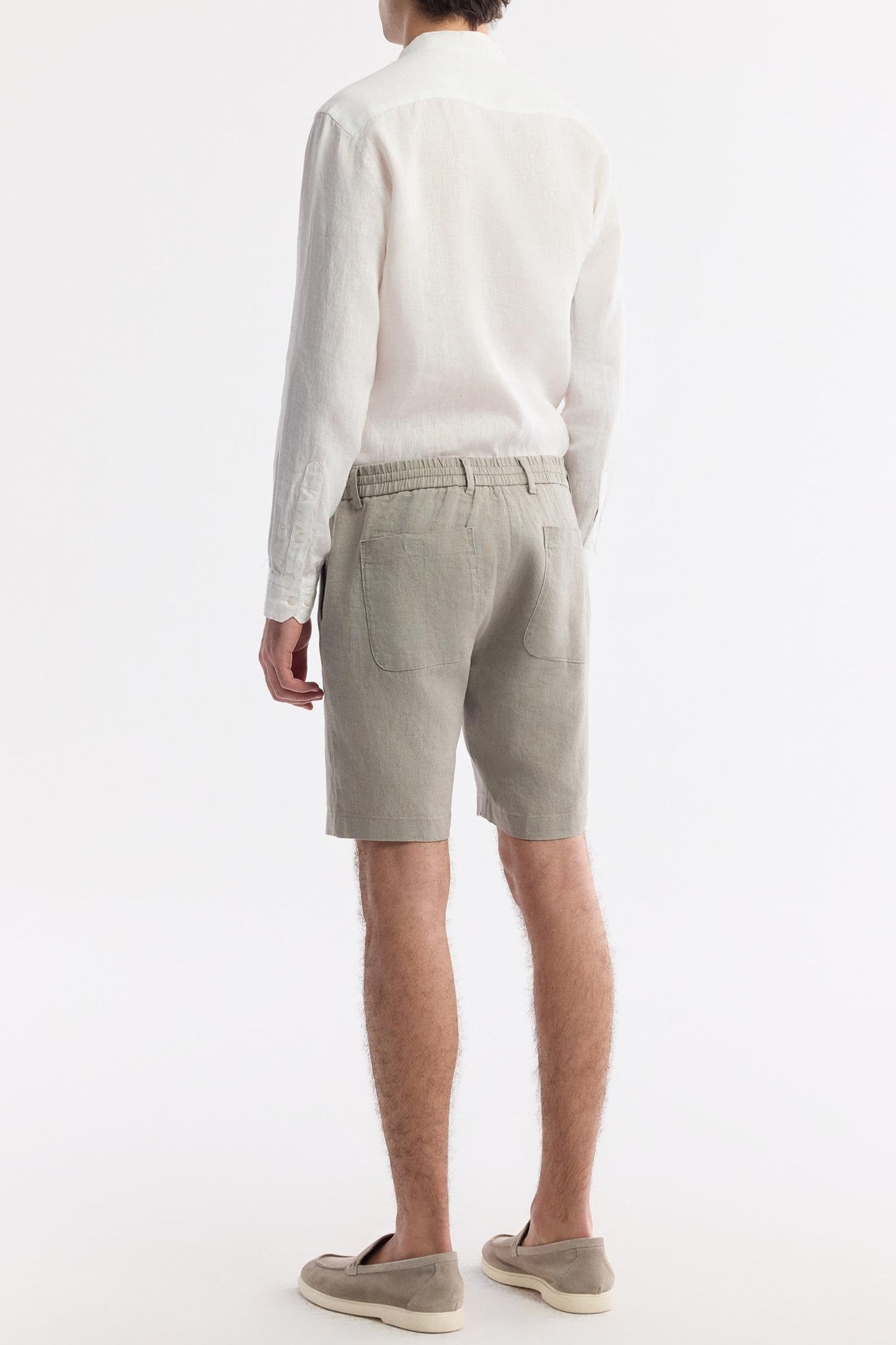 Rear view showing dual pockets and soft elastic band of the shorts
