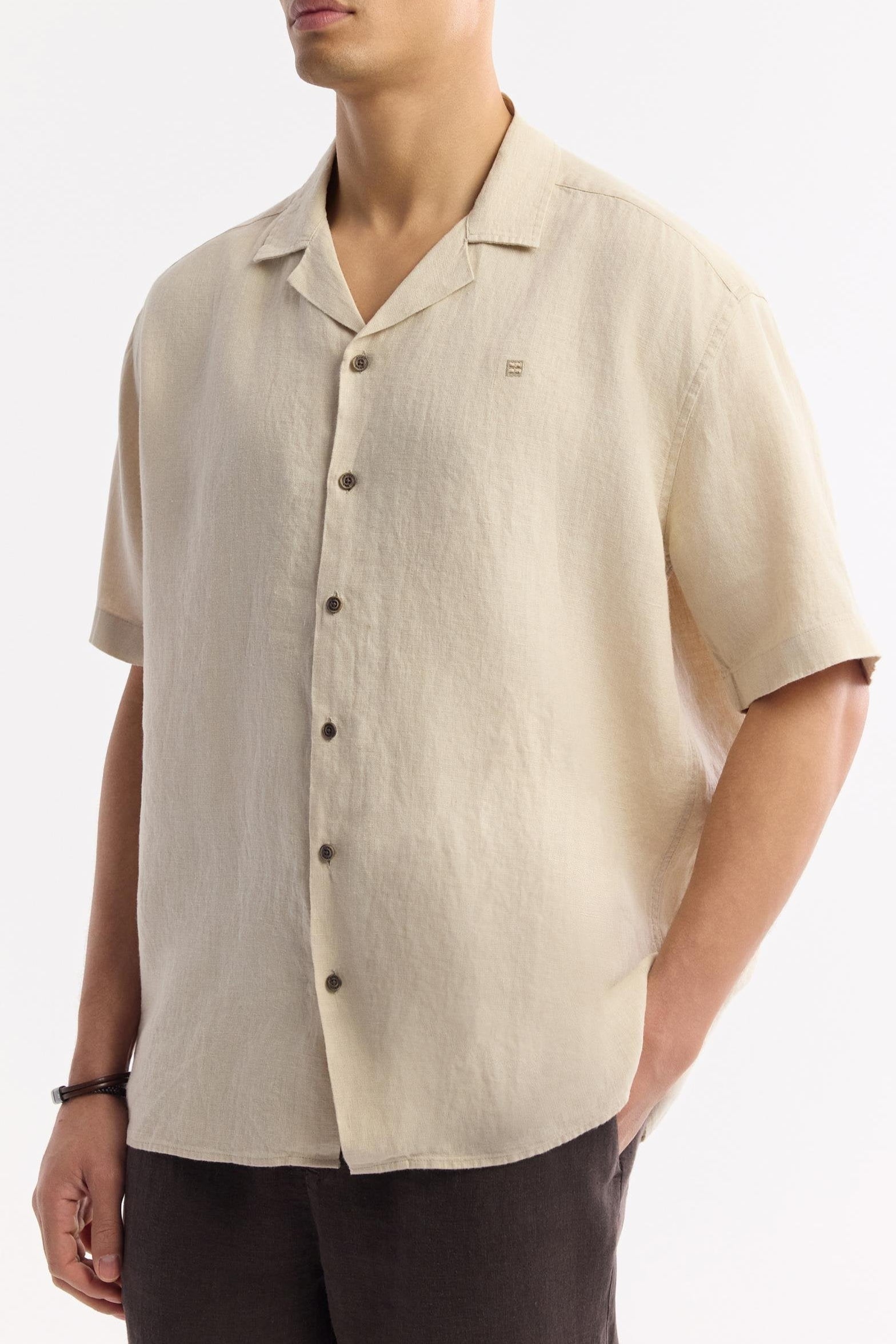 Angled close-up of Swiftyle Men's Beige Shirt highlighting fabric texture