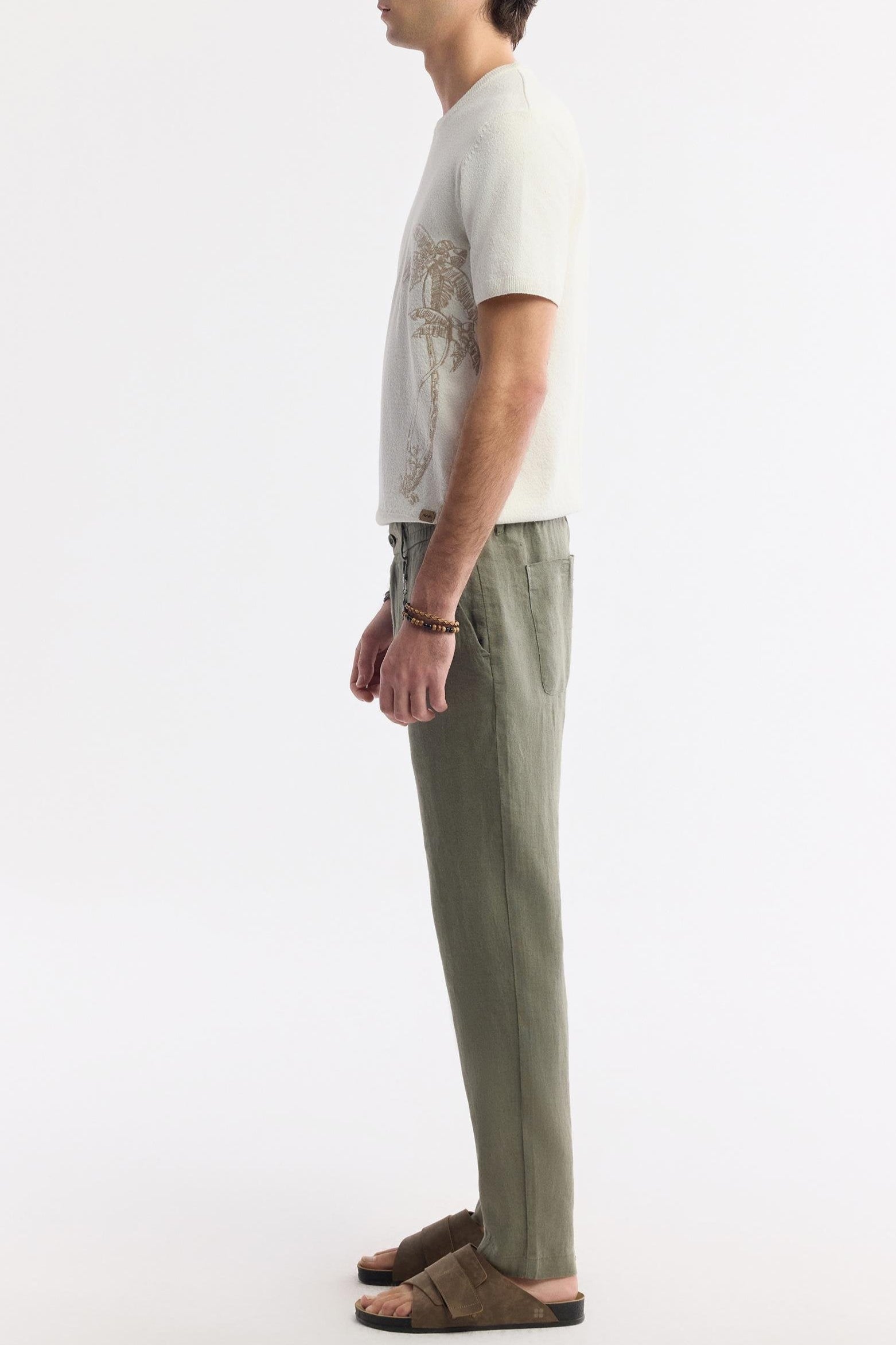 Side view of model in Olive Green Linen Pants