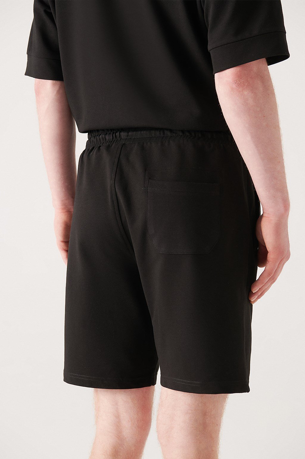 Rear view of black cotton shorts with patch pocket – Swiftyle