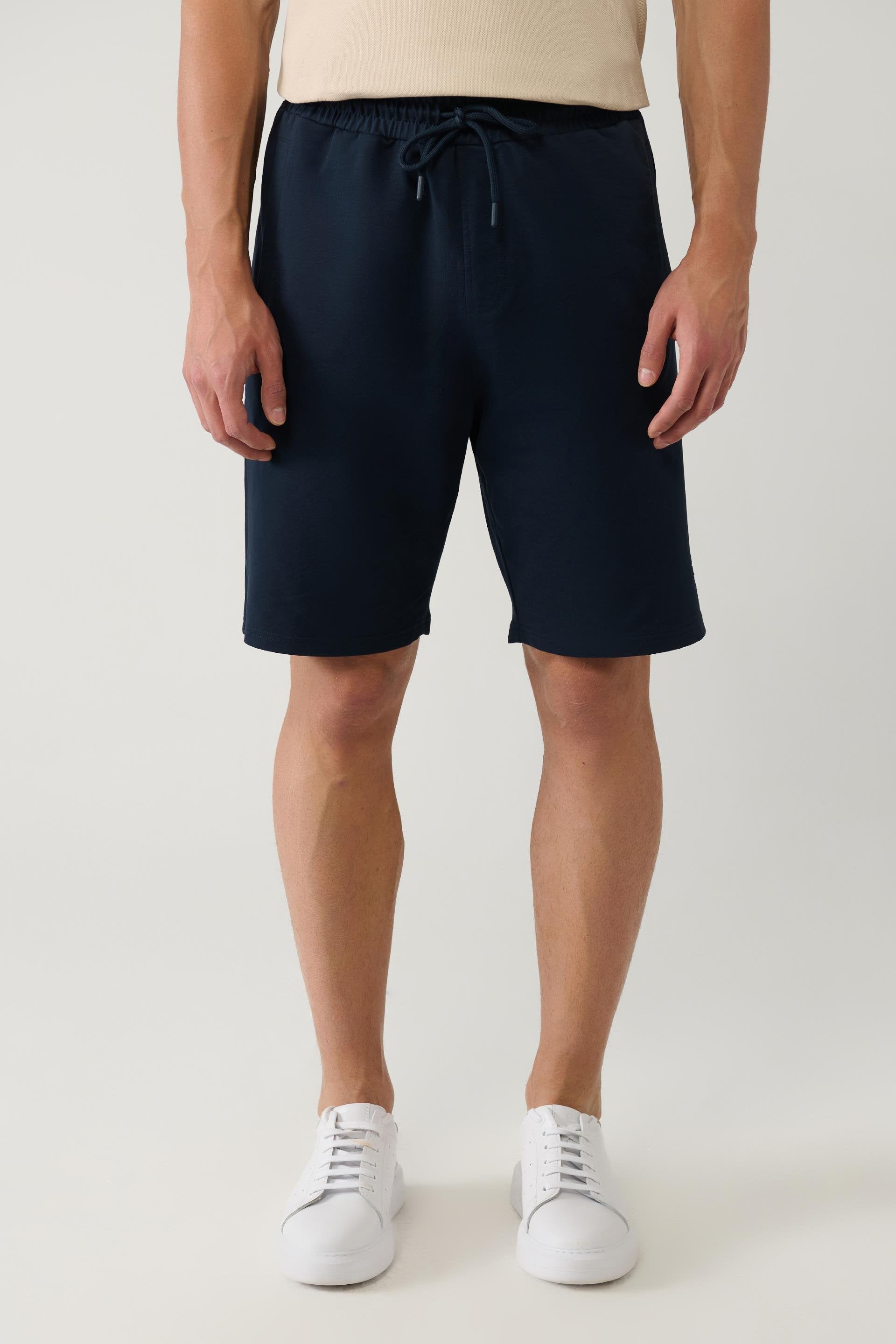 Close-up of front view navy cotton shorts and drawstring – Swiftyle
