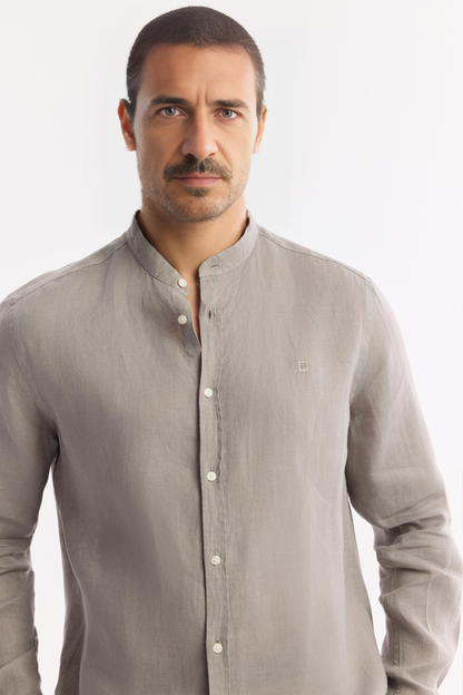 Close-up of buttons and fabric texture on gray linen shirt
