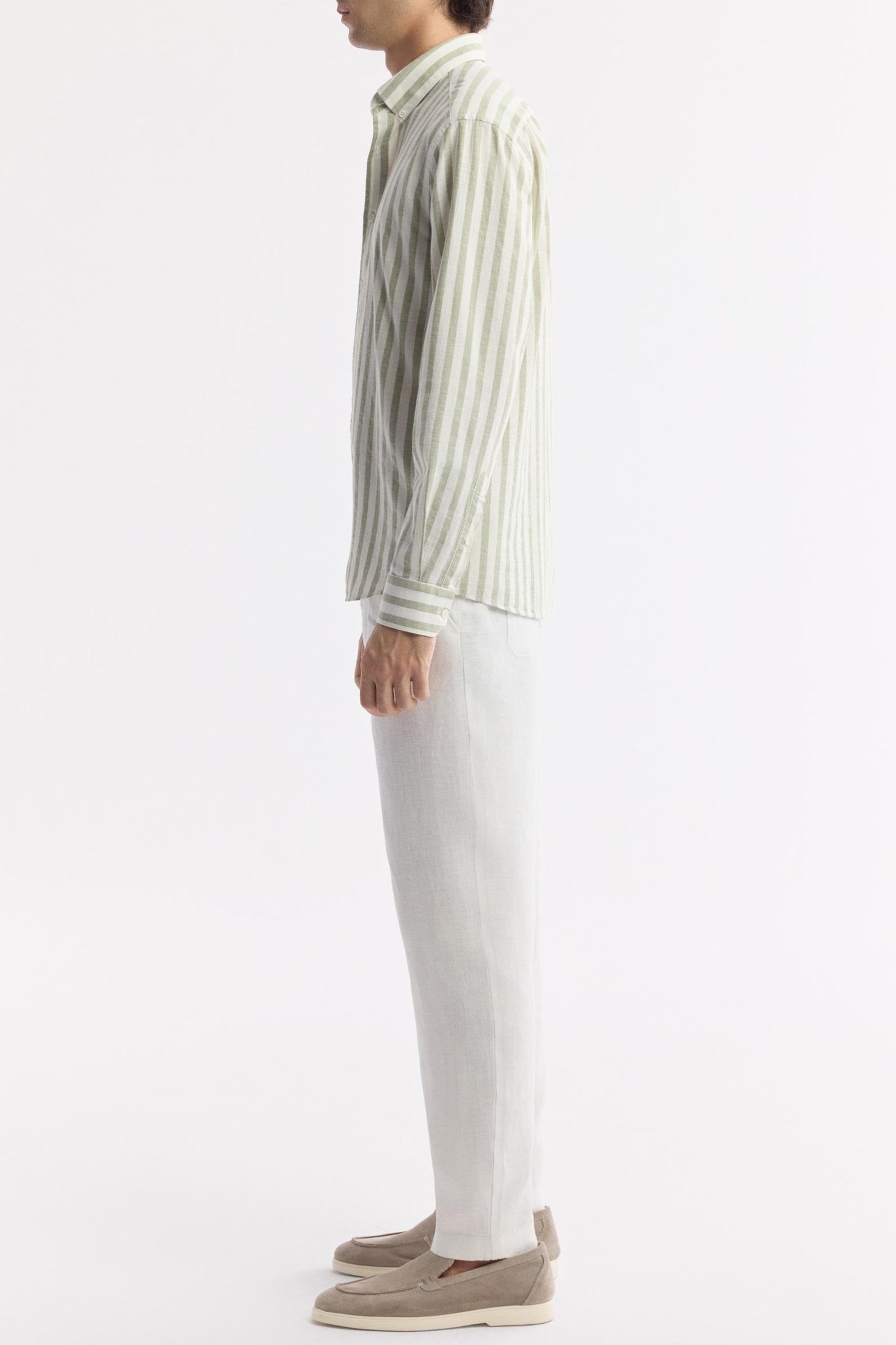 Side view of model in green striped Egyptian cotton shirt