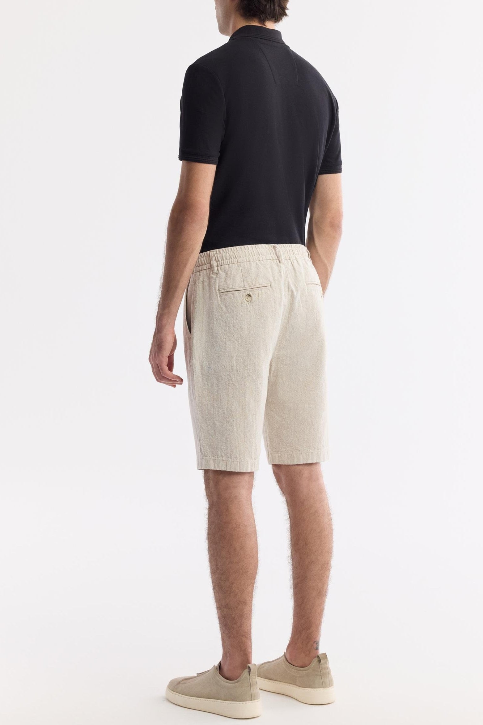 Back view of men’s beige linen shorts with elastic waistband – Swiftyle