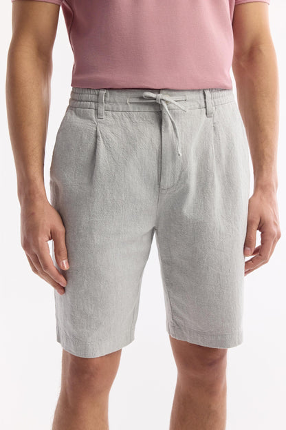 Close-up of drawstring waist and pleats on gray linen shorts – Swiftyle