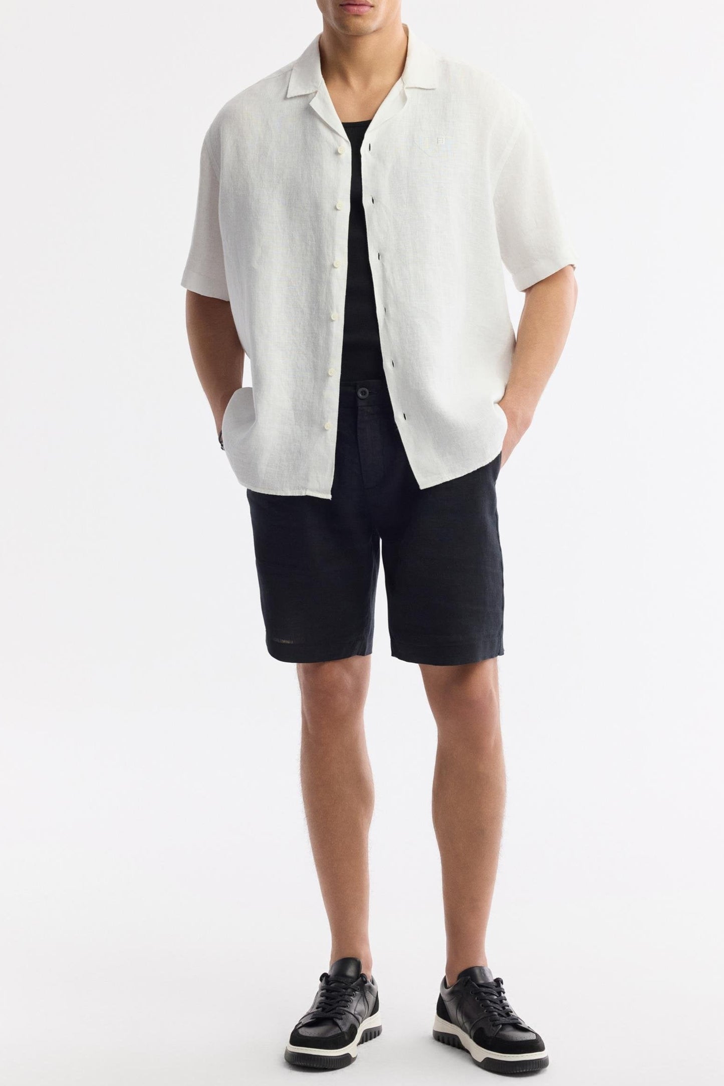 White camp collar shirt styled with black shorts – Swiftyle
